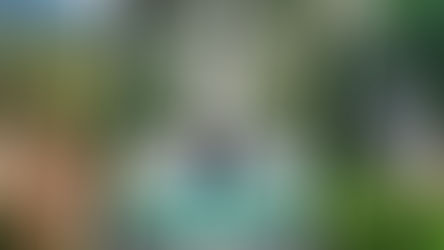 Couple enjoying a road trip in Khao Yai, Thailand, standing beside a white car with scenic views of Toscana Valley, forest roads, and waterfalls