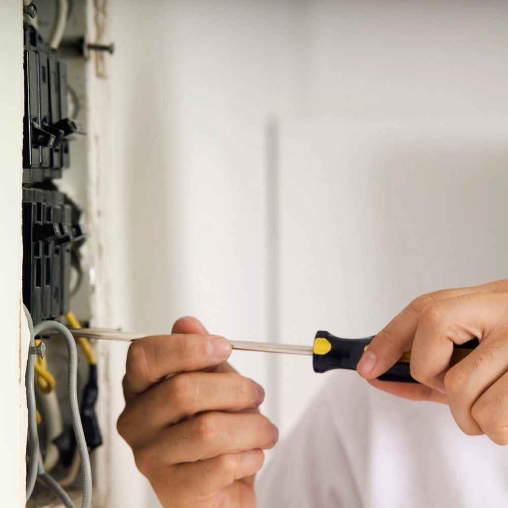 Electrician fixing an Electrical Issue