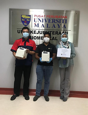 in front of UMMC plaque.jpeg