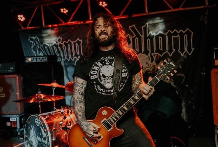Raging Speedhorn guitarist on stage wearing born 2 bleed never give up skull t-shirt