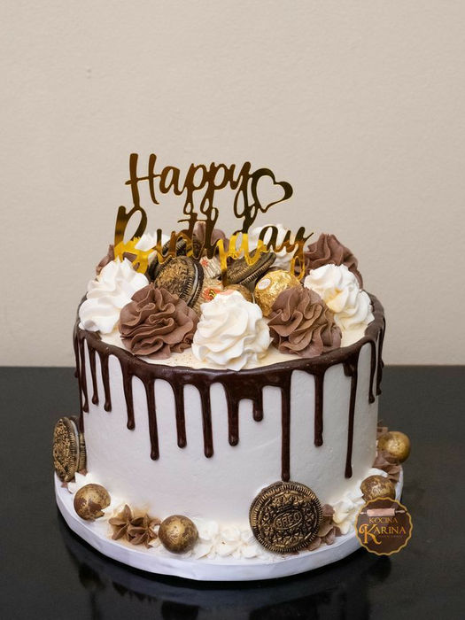 Birthday cake with Happy Birthday text and chocolate decorations on table My Site 3
