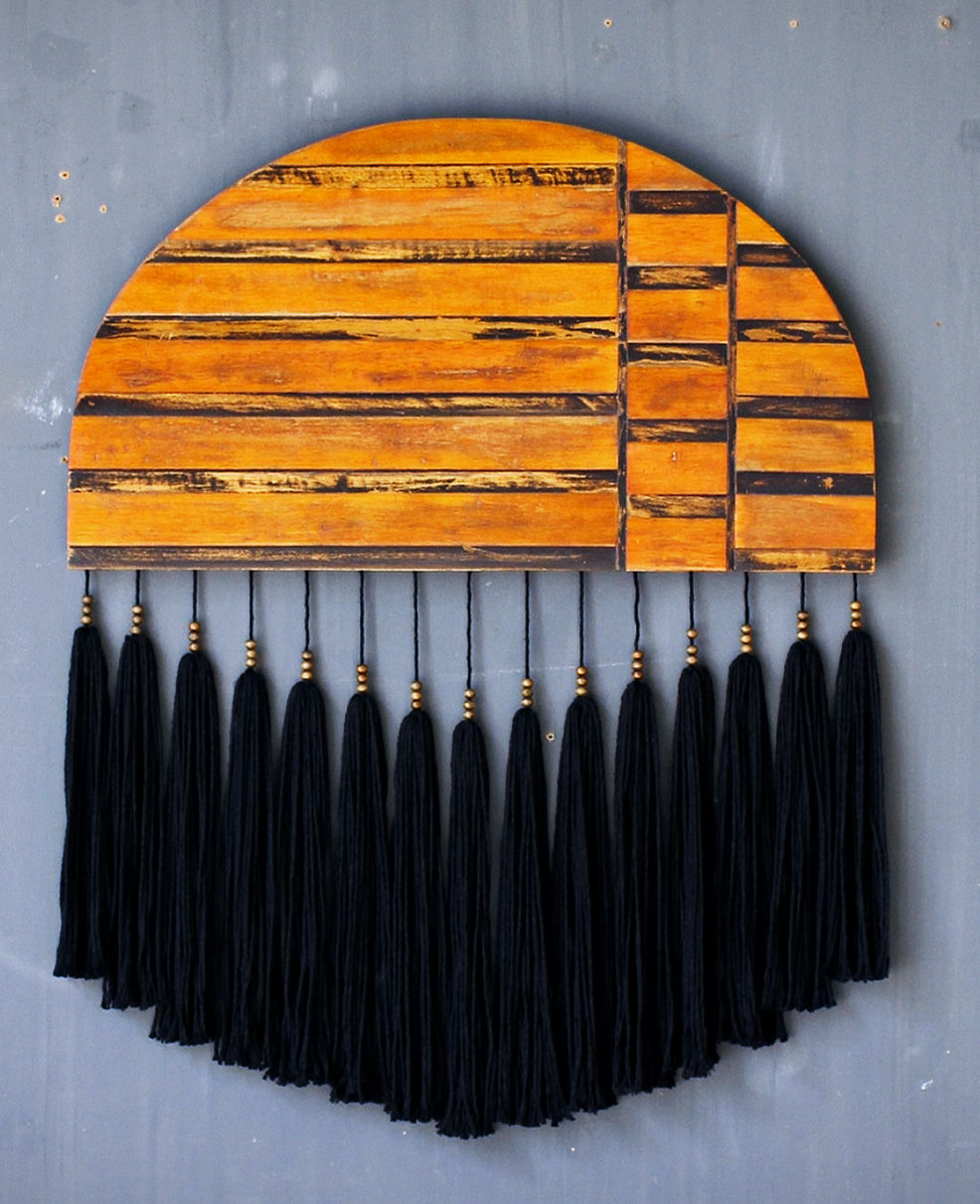 Macrame artwork made by studio oryx with reclaimed wood