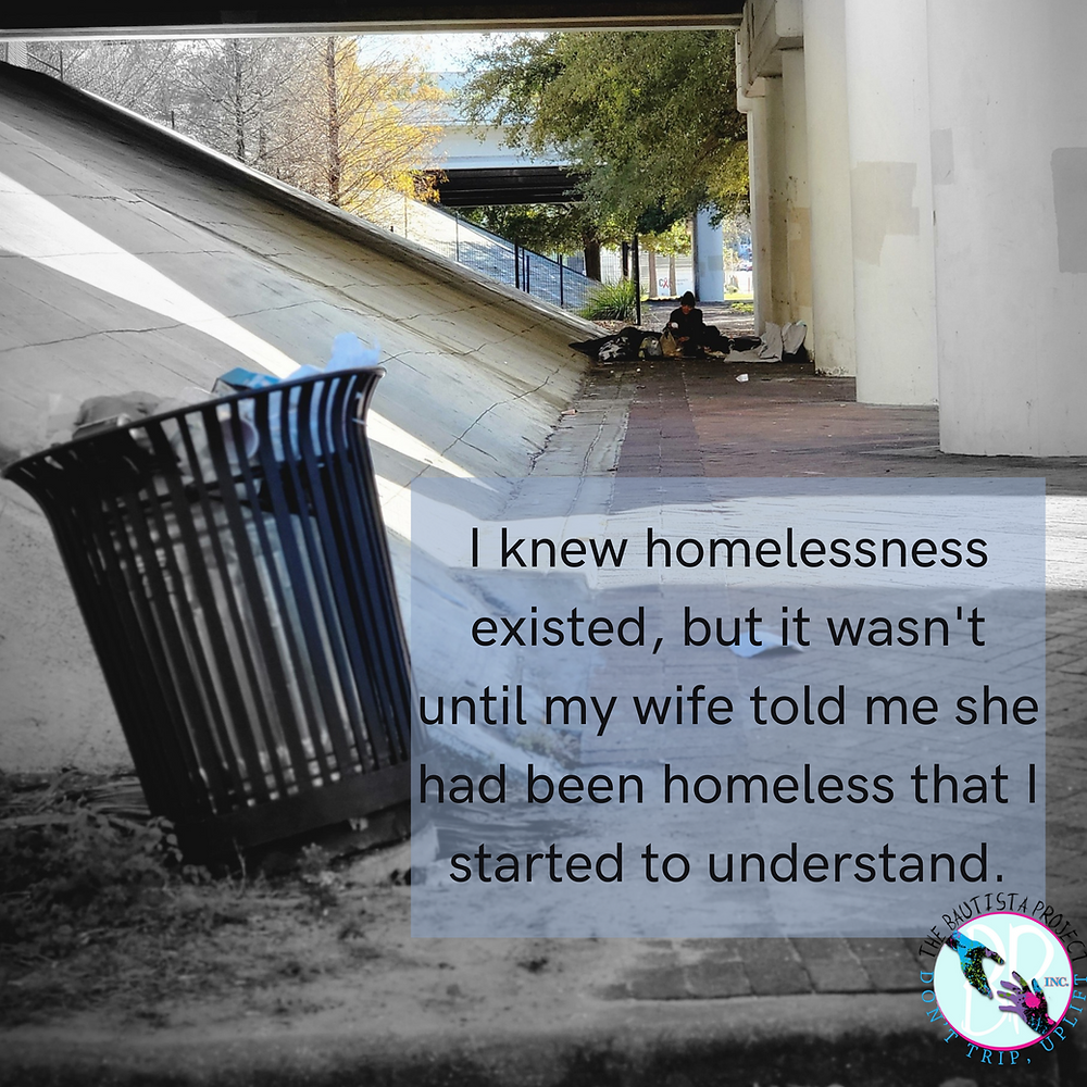 a picture of a homeless person sleeping under the overpass in downtown Tampa