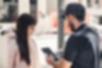 a delivery man helping customers