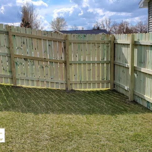 Green treated fence.jpeg