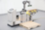 Collaborative robot palletizer working safely with human operators to stack packages.