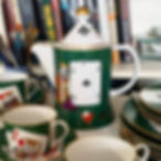 Porcelain teapot with poker card motif, green glazed porcelain