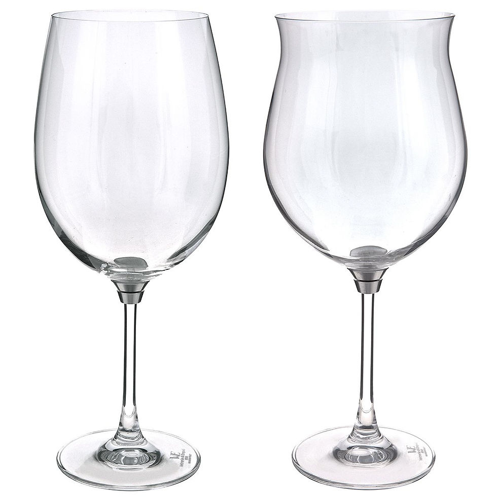 Pair of Vortice Platinum crystal spinning wine glasses with open bowls displayed on a reflective table