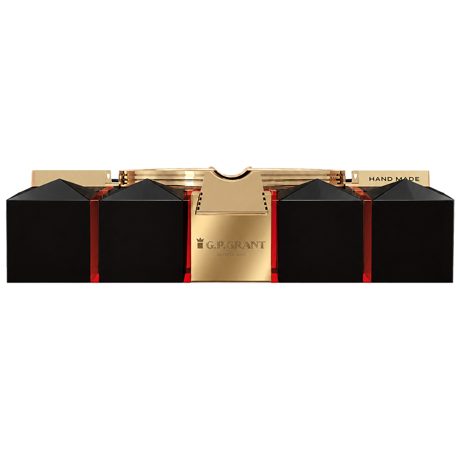 Side profile of obsidian pyramid cigar ashtray with red glowing edges and engraved gold logo, オブシディアン ピラミッド シガー灰皿