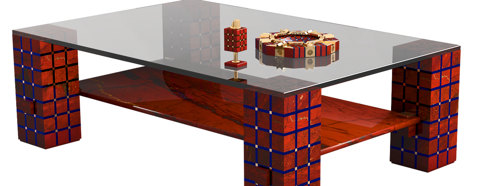 Oggetti da Interno, Mobili in Pietra e Accessori Realizziamo pezzi d’interni squisiti utilizzando Diasproa Rossa, portando eleganza e sofisticazione uniche ai tuoi spazi. La nostra collezione include una varietà di oggetti come mobili, lampade da tavolo, cornici fotografiche, accessori da scrivania e molte altre creazioni uniche che incarnano il lusso e il gusto raffinato.   Ogni pezzo in Diaspro Rossa non è solo funzionale, ma una vera e propria opera d’arte, che mostra il tuo apprezzamento per il design e i dettagli. Le ricche tonalità rosse della Diaspro Rossa, combinate con elementi decorativi realizzati con maestria, fanno di questi oggetti un’aggiunta perfetta a qualsiasi ambiente.   Il Red Jasper Coffee Table è una straordinaria dimostrazione di maestria artigianale, composto da 1.024 pezzi fatti a mano di Diaspro Rossa, bronzo e vetro. Questo pezzo in edizione speciale evidenzia la bellezza senza tempo della Diaspro Rossa, trasformandola in una sofisticata opera d’arte. La fusione perfetta di lusso e arte, questo tavolo offre un’aggiunta unica a qualsiasi stanza, portando un’eleganza ineguagliabile e un fascino naturale. Ogni componente del tavolo è progettato per riflettere la bellezza naturale della pietra e i suoi dettagli intricati, rendendolo un punto focale affascinante in qualsiasi spazio.