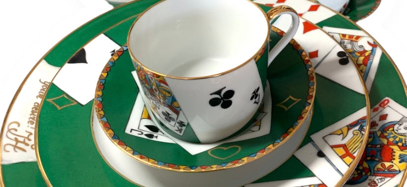Porcelain Poker Mugs and Plates: This elegant collection of hand-painted porcelain coffee mugs and plates, adorned with poker motifs, is made from the finest Limoges porcelain. Available in dinner and dessert sizes, they exude luxury and sophistication.