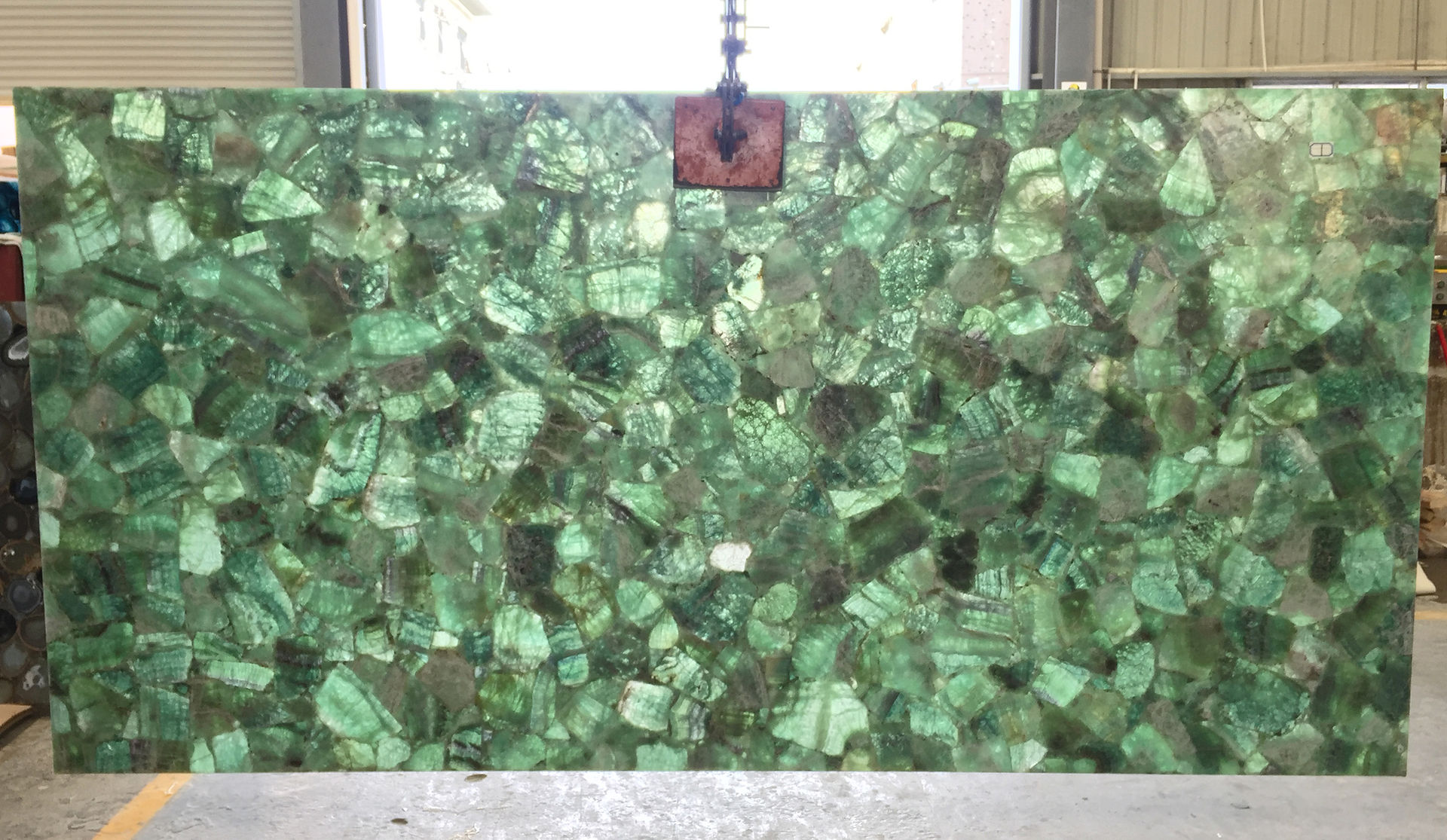 Backlit stone panels made of Green Fluorite translucent gemstone for interior wall cladding and vanity countertops