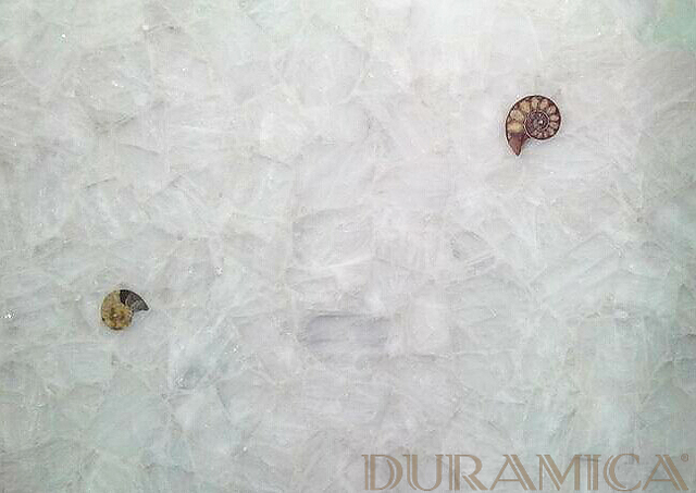 White Quartz: Durable and Low-Maintenance Elegance  White Quartz is a natural stone composed primarily of quartz crystals. It is widely used in kitchen countertops, flooring, and bathroom vanities due to its high durability and ease of maintenance. Like onyx, some varieties of quartz can also be backlit, creating a soft, glowing effect.