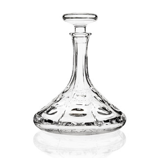 MARIO CIONI Transparent wine carafe on a marble countertop in soft lighting.