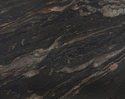Brown Barocco granite is a luxurious natural stone with deep brown tones, rich veining, and dynamic patterns. Ideal for countertops, floors, and wall cladding, it adds warmth and elegance to both classic and modern interiors.
DE
Brown Barocco Granit ist ein edler Naturstein mit tiefen Brauntönen, markanter Maserung und dynamischem Muster. Perfekt für Arbeitsplatten, Böden und Wandverkleidungen – er verleiht jedem Raum Wärme und Eleganz.
ES
El granito Brown Barocco destaca por sus tonos marrones intensos, vetas ricas y patrones dinámicos. Ideal para encimeras, suelos y paredes, aporta calidez y sofisticación a cualquier ambiente.
FR
Le granit Brown Barocco présente de profonds tons bruns, des veines riches et des motifs dynamiques. Parfait pour plans de travail, sols et murs, il apporte chaleur et élégance aux intérieurs classiques ou modernes.
IT
Il granito Brown Barocco ha tonalità marroni intense, venature ricche e disegni dinamici. Perfetto per piani cucina, pavimenti e rivestimenti, aggiunge calore ed eleganza agli ambienti classici e contemporanei.
AR
غرانيت Brown Barocco يتميّز بدرجات بنية غنية وعروق واضحة وأنماط ديناميكية. مثالي لأسطح المطابخ والأرضيات وتكسية الجدران، ويمنح الدفء والفخامة للمساحات الكلاسيكية والعصرية.
RU
Гранит Brown Barocco — это благородный натуральный камень с насыщенными коричневыми оттенками, выразительными прожилками и динамичным рисунком. Идеален для столешниц, полов и стен, придавая интерьеру тепло и элегантность.