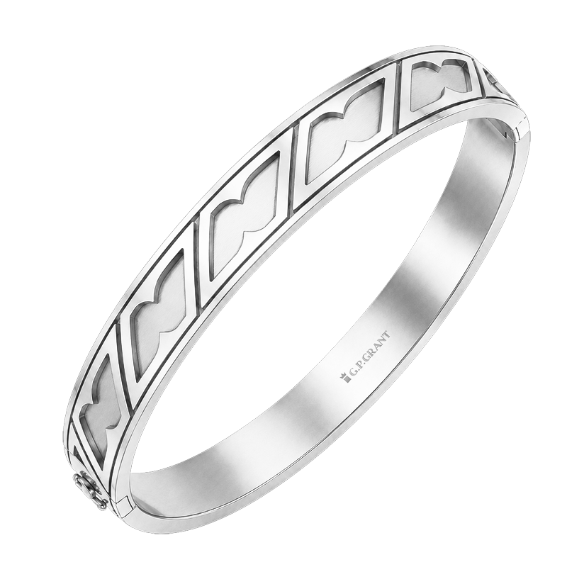 Premium wide white gold rigid bangle with intricate geometric etching for high-end unisex jewelry collection. Bracelet en or