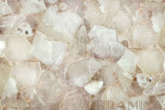 White Quartz: Durable and Low-Maintenance Elegance  White Quartz is a natural stone composed primarily of quartz crystals. It is widely used in kitchen countertops, flooring, and bathroom vanities due to its high durability and ease of maintenance. Like onyx, some varieties of quartz can also be backlit, creating a soft, glowing effect.