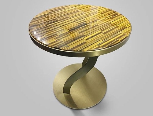 Explora nuestra selección de muebles de piedra y complementos para descubrir cómo el encantador Ojo de Tigre puede enriquecer tu interior con un elegante toque de lujo.