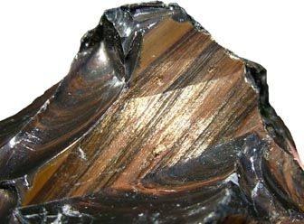 Golden Obsidian  Featuring radiant golden sparkles from pyrite or hematite inclusions, this type creates a mesmerizing effect of captured sunlight. Often reserved for luxurious jewelry and bespoke items.