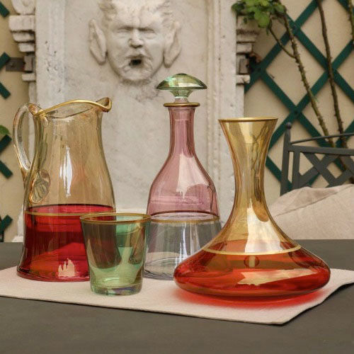 GRIFFE MONTENAPOLEONE and VETRERIE DI EMPOLI present this luxurious crystal decanter adorned with gold plating.