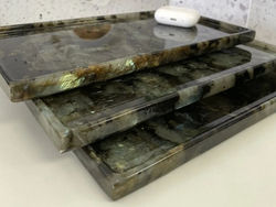 Square Labradorite Blue tray with natural crystal pattern placed on magazine