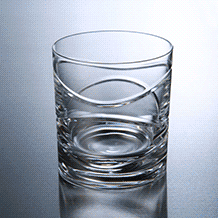 Miniatura: Rotating glass tumbler with smooth wave cuts for scotch and bourbon lovers
