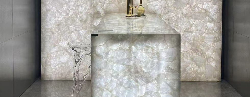 Final Thoughts: If you seek unparalleled elegance and luxurious aesthetics, both materials are excellent choices. Both can be backlit. Onyx stands out with its large, continuous patterns, while quartz offers a unique appeal as a panel composed of smaller pieces.