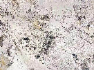 The natural translucent quartz inclusions in this white granite, Splendor White, create a unique translucent granite, making it an ideal transparent granite and spectacular backlit granite option.