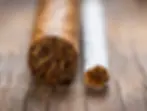 A Cigar Is Not a Cigarette
To the uninitiated, a cigar may seem like just a large cigarette. But thatโs a major misconception.
A cigarette is a quick fix for nicotine hunger.
A cigar is a ritual โ a philosophy, a form of contemplation.
Cigarettes are made from chopped tobacco mixed with chemicals that make burning easier and smoother.
A premium cigar, however, is crafted entirely from whole tobacco leaves that have undergone long fermentation.
It has no filter, no chemical additives, and no combustion enhancers. Each leaf plays its role โ from the wrapper to the binder โ creating a complex and rich aroma.
Smoking a cigar is not an act of consuming nicotine. Itโs an act of enjoyment โ like comparing a quick espresso on the go to a full tea ceremony.