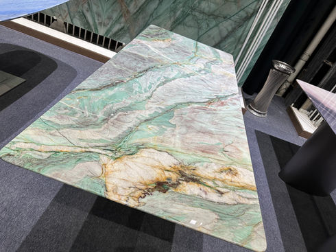 Polished green and white marble dining table top.