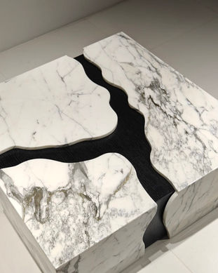 White marble table with black river design