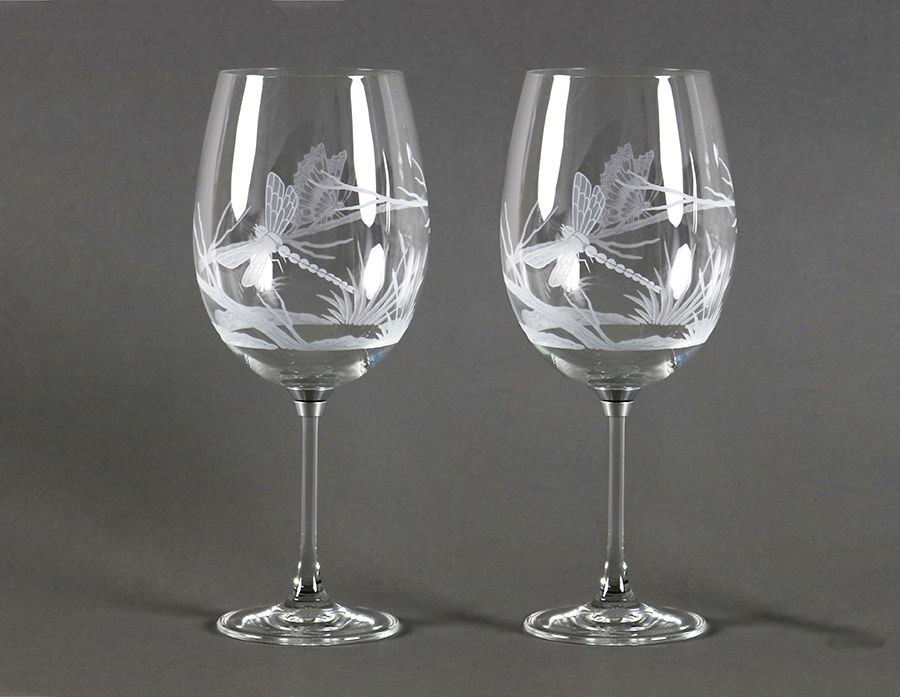 Pair of Vortice Platinum crystal spinning wine glasses featuring hand-engraved open bowls