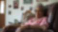 mark50x_a_photograph_of_a_smiling_senior_reclining_in_a_recline_6ebd6e19-3935-40e8-8416-bf