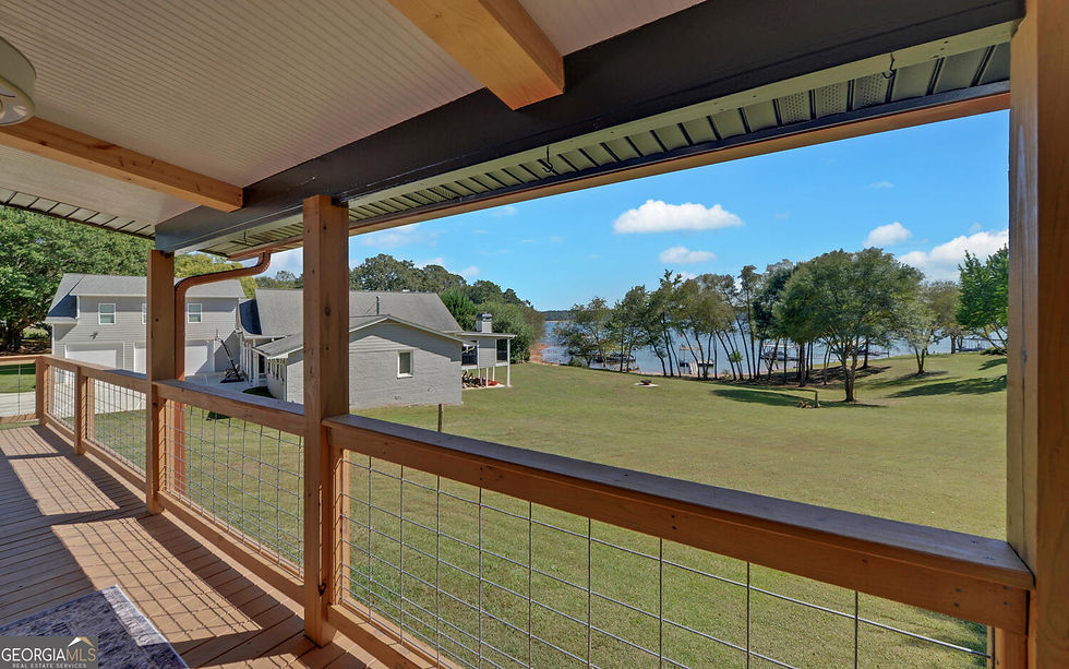 Wide angle view of a peaceful lake with boats docked near a lakefront home