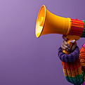 vecteezy_activist-in-colorful-sweater-with-megaphone-on-purple-a_49039372.jpg