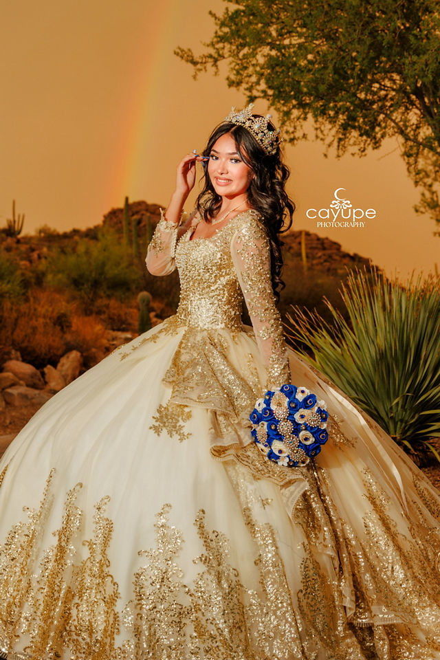 Beautiful quinceanera with a golden hour sunset in a desert