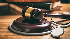judge-gavel-and-a-stethoscope-on-a-woode