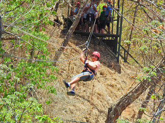 A lady ziplining in Costa Rica