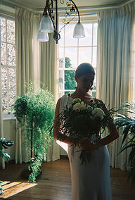Film photography of Miami wedding dress by True Bride with fresh greenery bouquet.