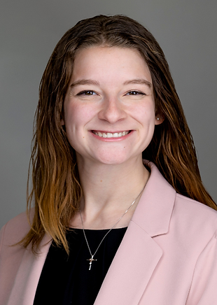 Landree Ashby smiles in a pink blazer