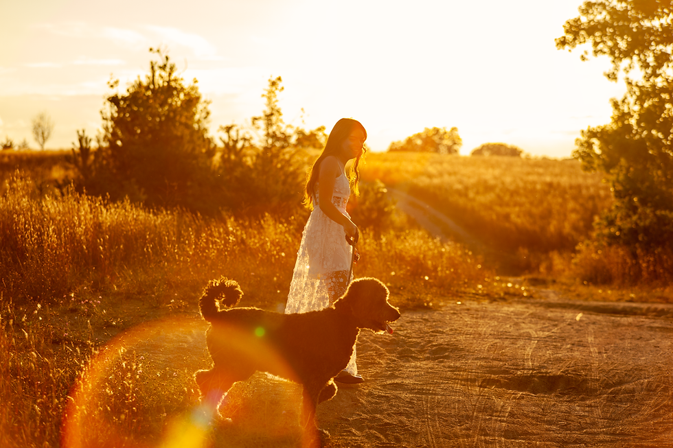 Eye-level view of a high school senior posing outdoors with natural light