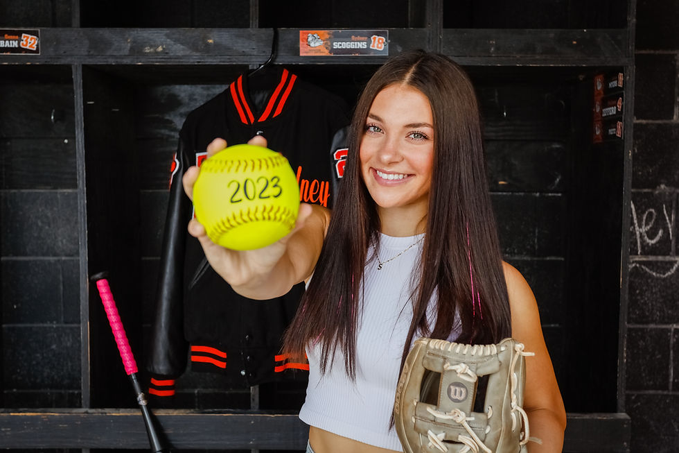 Close-up view of a camera on a tripod capturing a senior’s graduation cap and gown