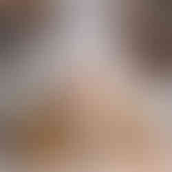 baby in a bucket smiling on a Christmas themed backdrop