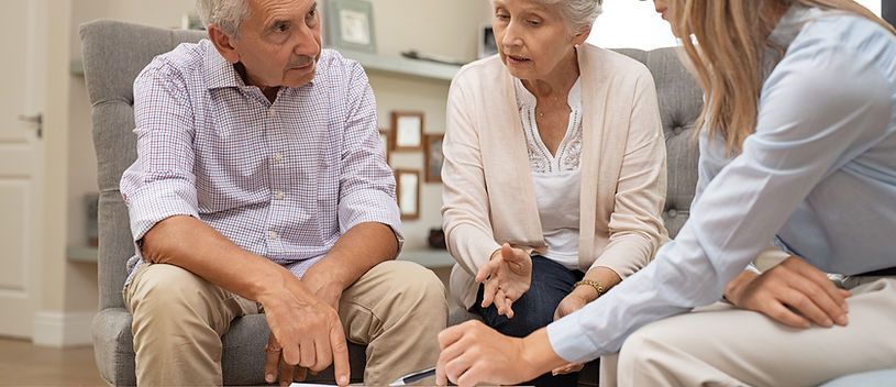 Older couple consulting with an advisor