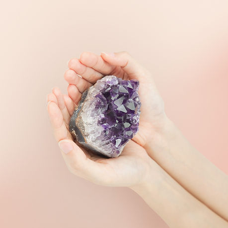 Hands Holding Amethyst