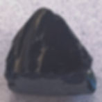 Deep black raw Obsidian crystal with a natural grey outer layer.
