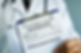 A doctor holding a clipboard showing a diagnosis of rheumatoid arthritis