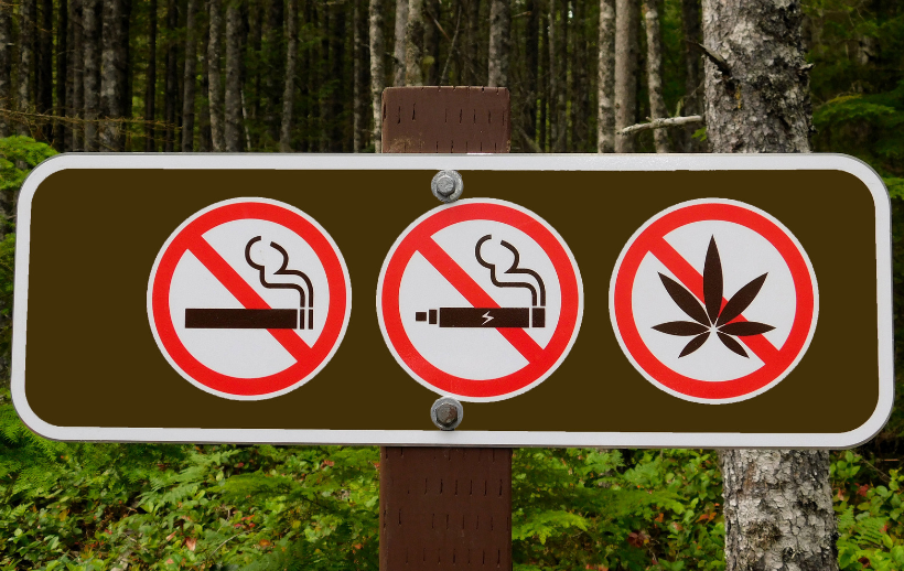 An outdoor sign that says no smoking, no vaping, and no cannabis