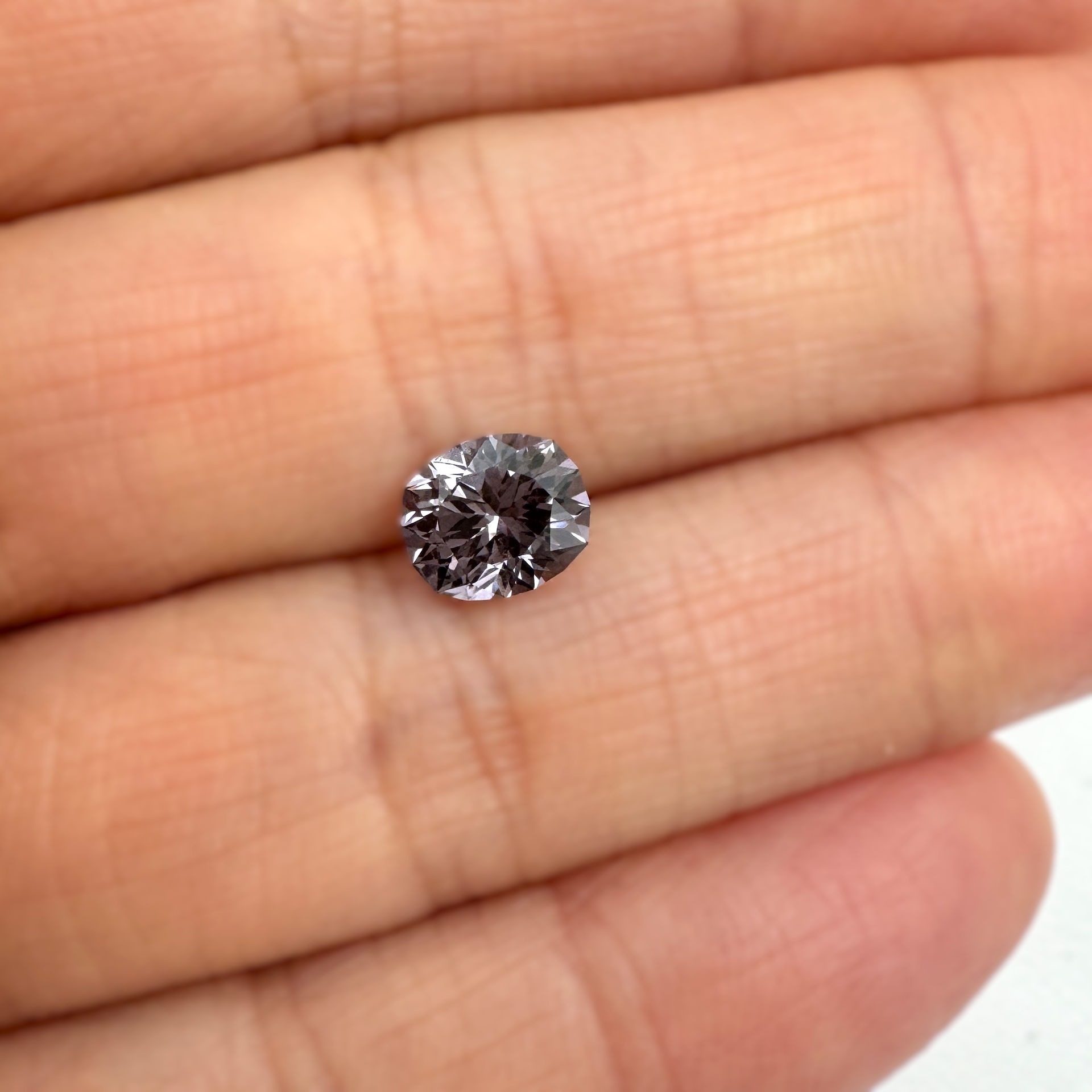 Violet Spinel  on the hand