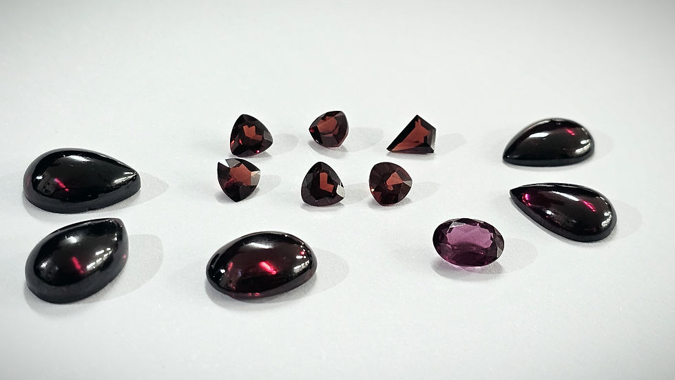 cabochon and faceted Garnets in various red hues